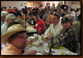 People enjoy their meal during the raffle give-a-way's and auction. Over 250 people attended the Rapid City 2009 fundraising banquet.