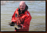 Mike Johnson with a tagged walleye just prior to releasing it.