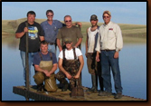 Volunteers that assisted in placing the dock at Waggoner Lake. Far right is Denny Bohls, project coordinator for the Rapid City Chapter. Agencies that helped make this possible include the Philip PD, Philip VFD, Haakon County Highway Department, SD GF&P and SDWU.