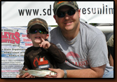 Lane and his dad with Lane's fish.