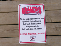 Sign installed at Curlew Dock.