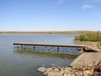 View of the Boat Ramp and Dock at Curlew Dam looking East.