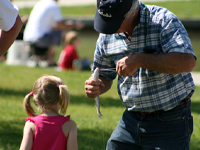 Ken Edel assists a successful young angler.