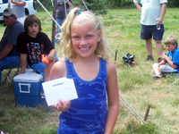 Alexis F. with 18 inch largemouth bass. Alexis won a $50.00 gift certificate to Scheels for having the longest fish.