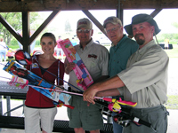 Alison Lessard (EAFB Commercial Sponsorship Coordinator) accepts 6 rod/reel combos from RCAC at the 'Party at the Lake'. Members shown from left to right: Ray Barck, Lee Jensen and Michael Johnson. Not shown - Loren Kasuske.