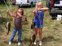 Samantha and Alexis F. with their catch for the day.
